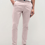 Mens pale pink chinos with front slanted pockets, jetted back pockets. zip fly fastening and brown horne buttons on the waistband and back pockets, the fit is a slim fit, this is worn with a white tee and white unbranded trainers