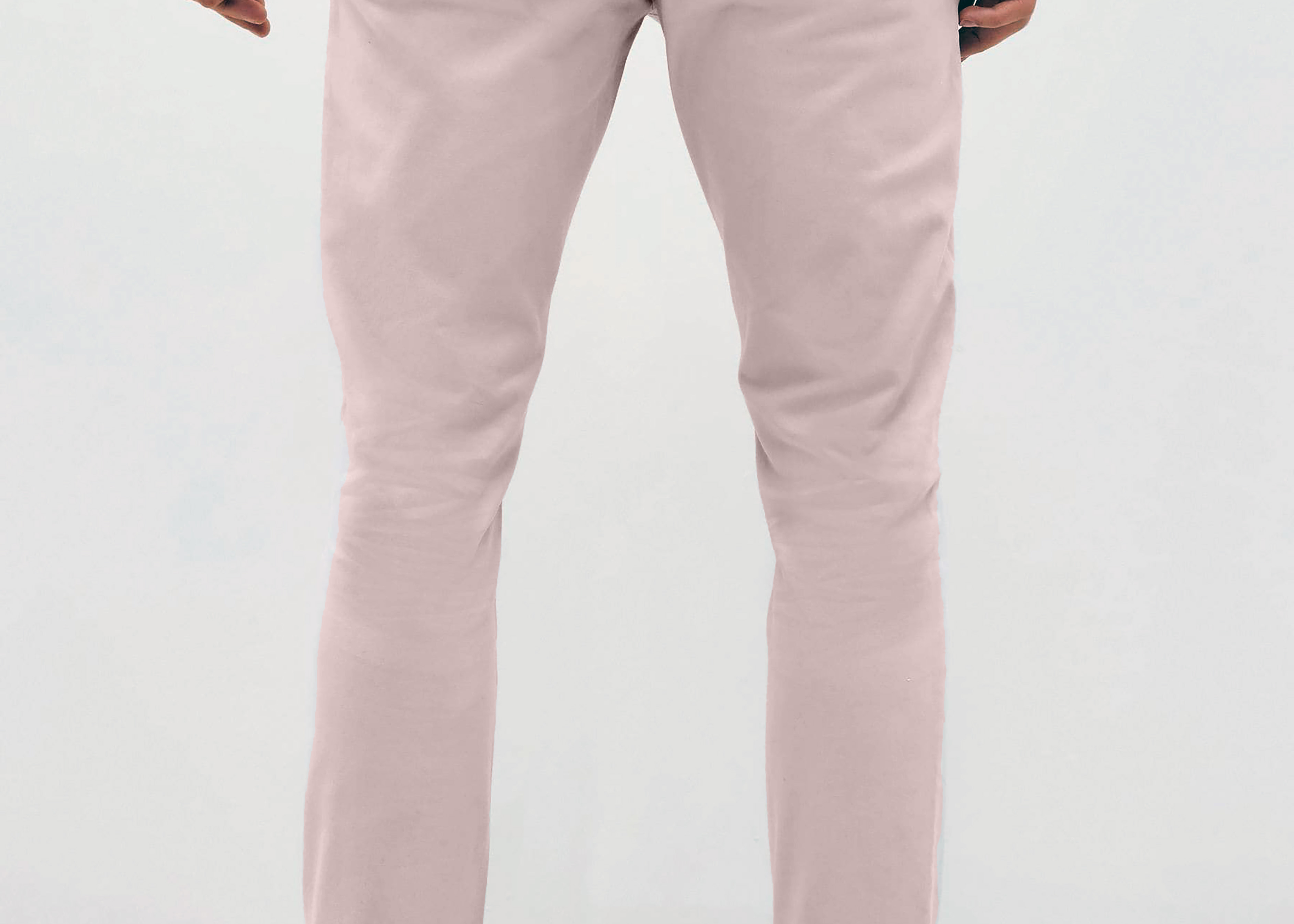 Mens pale pink chinos with front slanted pockets, jetted back pockets. zip fly fastening and brown horne buttons on the waistband and back pockets, the fit is a slim fit, this is worn with a white tee and white unbranded trainers