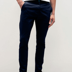 Mens Navy chinos with front slanted pockets, jetted back pockets. zip fly fastening and brown horne buttons on the waistband and back pockets, the fit is a slim fit, this is worn with a white tee and white unbranded trainers