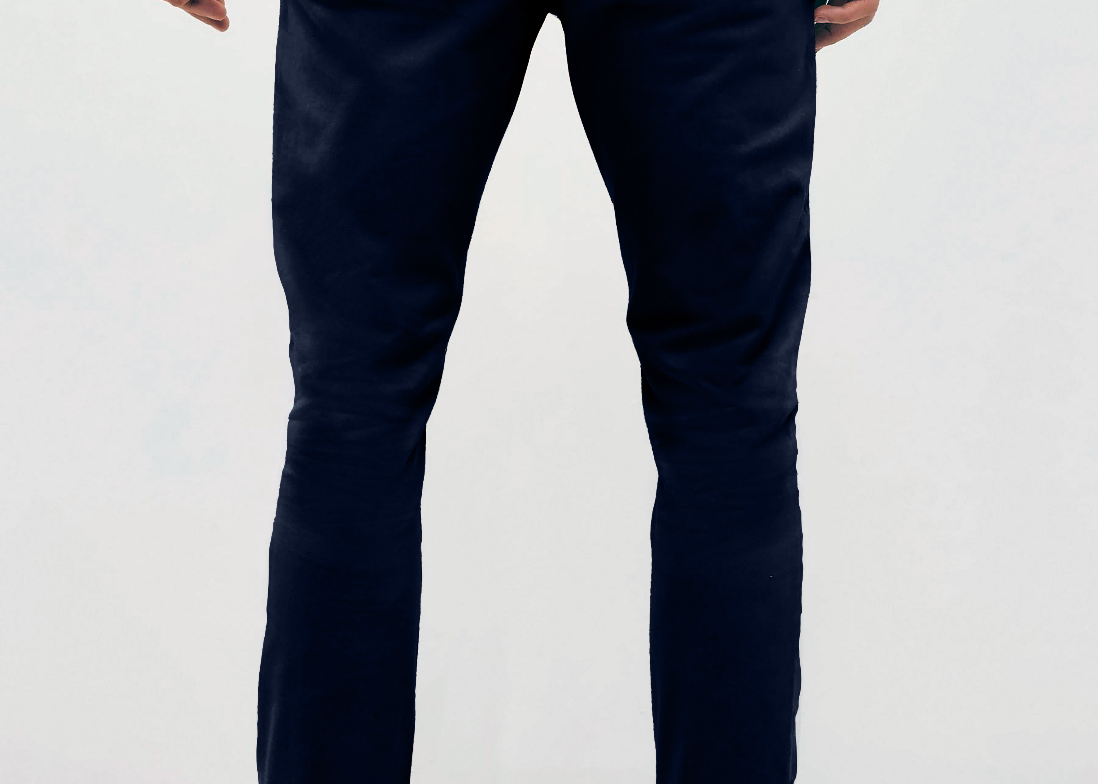 Mens Navy chinos with front slanted pockets, jetted back pockets. zip fly fastening and brown horne buttons on the waistband and back pockets, the fit is a slim fit, this is worn with a white tee and white unbranded trainers