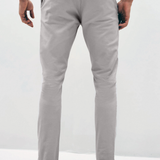 Mens Silver Grey chinos with front slanted pockets, jetted back pockets. zip fly fastening and brown horne buttons on the waistband and back pockets, the fit is a slim fit, this is worn with a white tee and white unbranded trainers