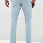 Mens sky Blue chinos with front slanted pockets, jetted back pockets. zip fly fastening and brown horne buttons on the waistband and back pockets, the fit is a slim fit, this is worn with a white tee and white unbranded trainers