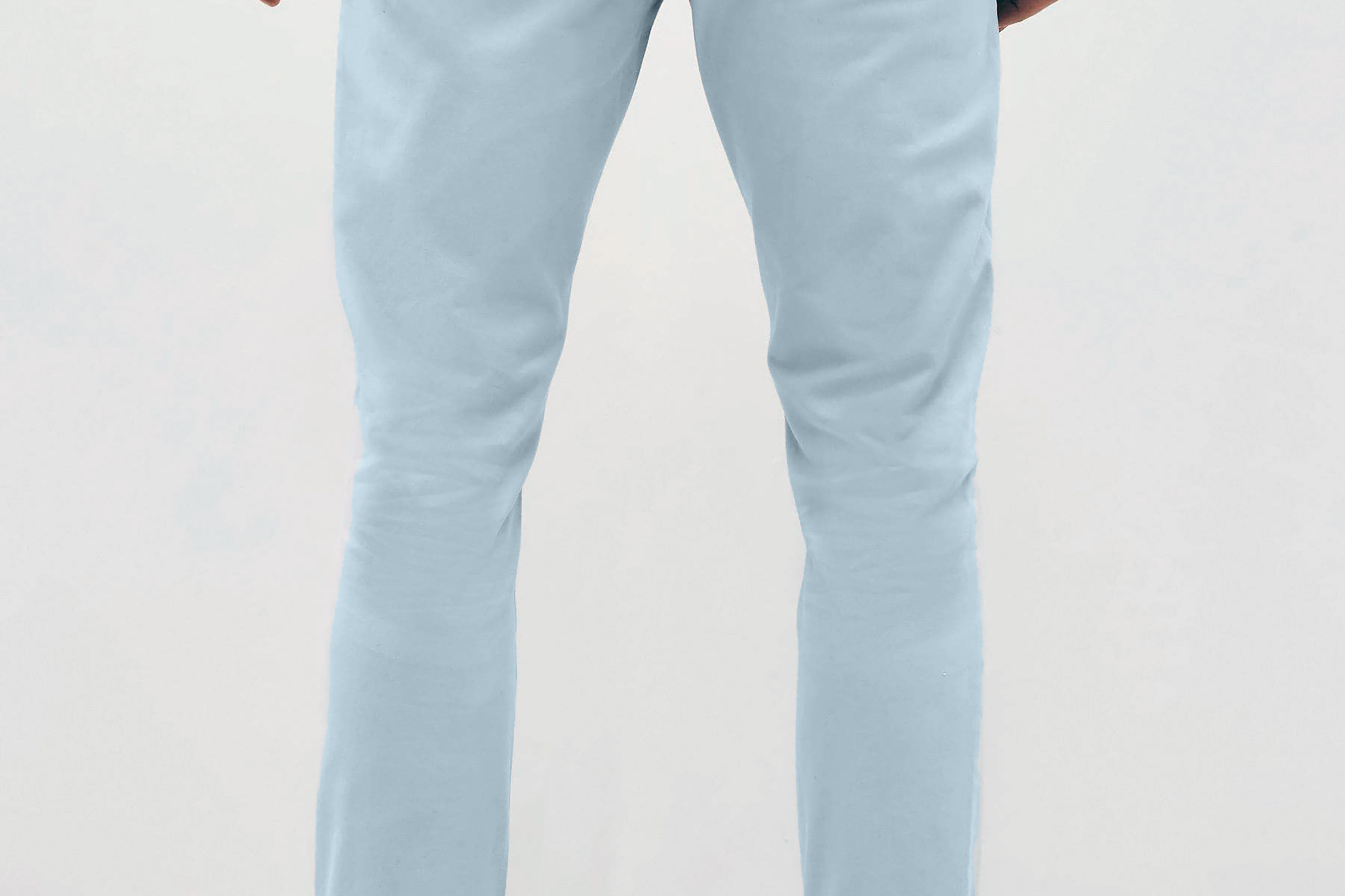 Mens sky Blue chinos with front slanted pockets, jetted back pockets. zip fly fastening and brown horne buttons on the waistband and back pockets, the fit is a slim fit, this is worn with a white tee and white unbranded trainers