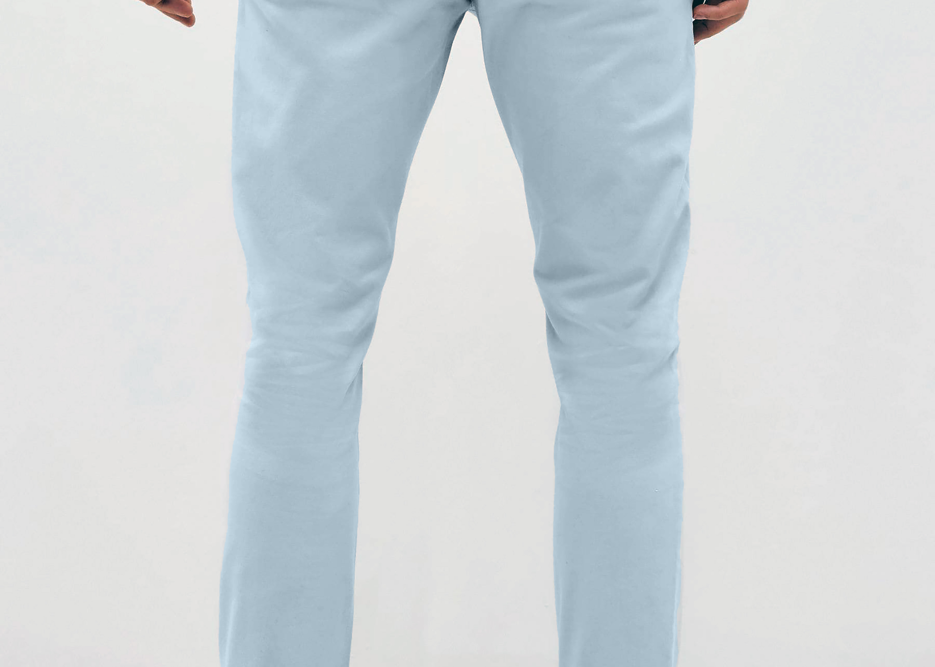 Mens sky Blue chinos with front slanted pockets, jetted back pockets. zip fly fastening and brown horne buttons on the waistband and back pockets, the fit is a slim fit, this is worn with a white tee and white unbranded trainers