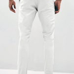 Mens white chinos with front slanted pockets, jetted back pockets. zip fly fastening and brown horne buttons on the waistband and back pockets, the fit is a slim fit, this is worn with a white tee and white unbranded trainers