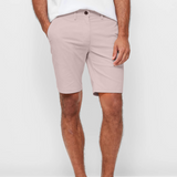 Mens pale pink chinos shorts with front slanted pockets, jetted back pockets. zip fly fastening and brown horne buttons on the waistband and back pockets, the fit is a slim fit, this is worn with a white tee and white t-shirt