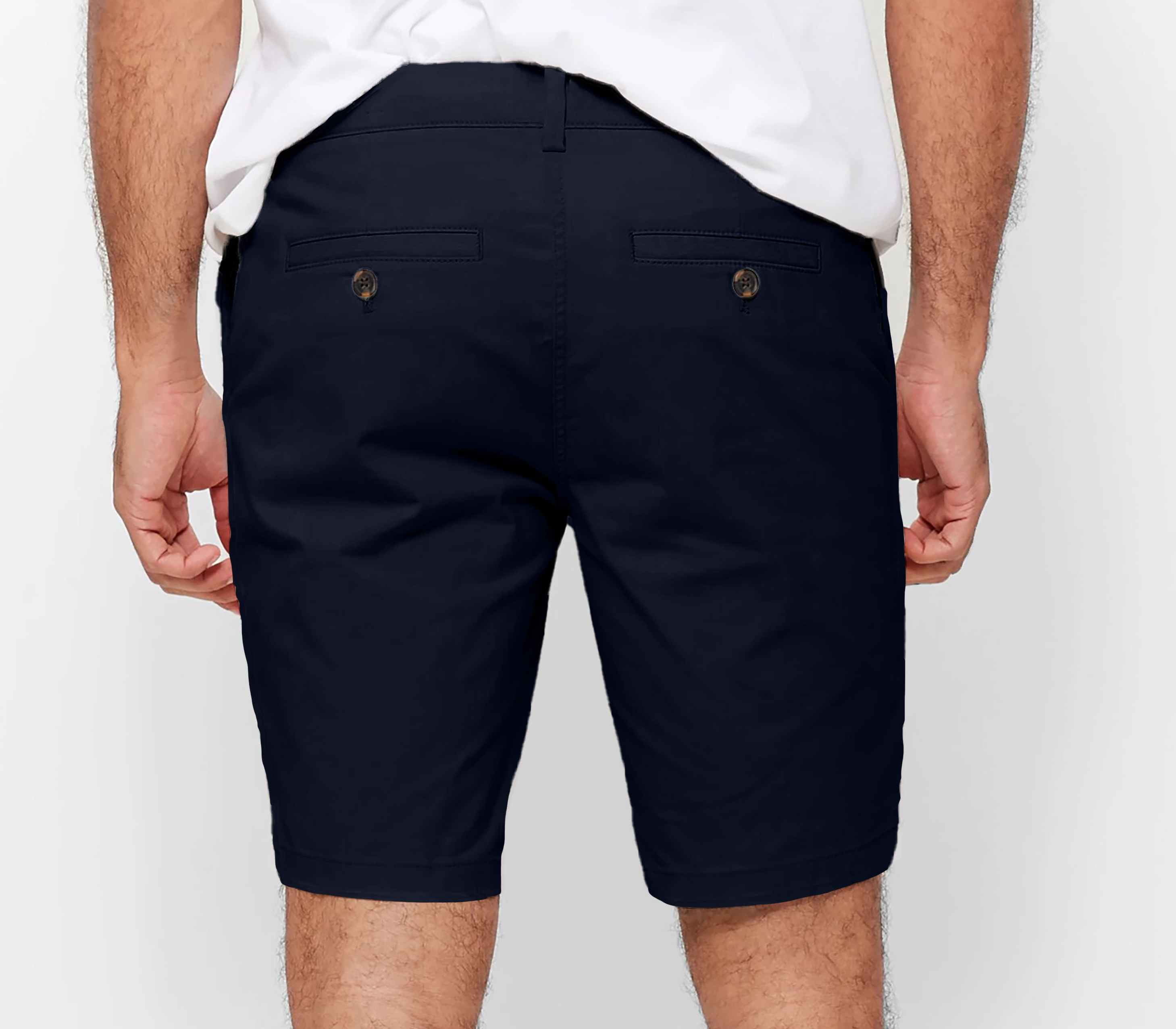 Mens Navy chinos shorts with front slanted pockets, jetted back pockets. zip fly fastening and brown horne buttons on the waistband and back pockets, the fit is a slim fit, this is worn with a white tee and white t-shirt