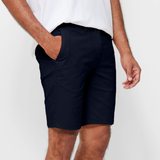 Mens Navy chinos shorts with front slanted pockets, jetted back pockets. zip fly fastening and brown horne buttons on the waistband and back pockets, the fit is a slim fit, this is worn with a white tee and white t-shirt