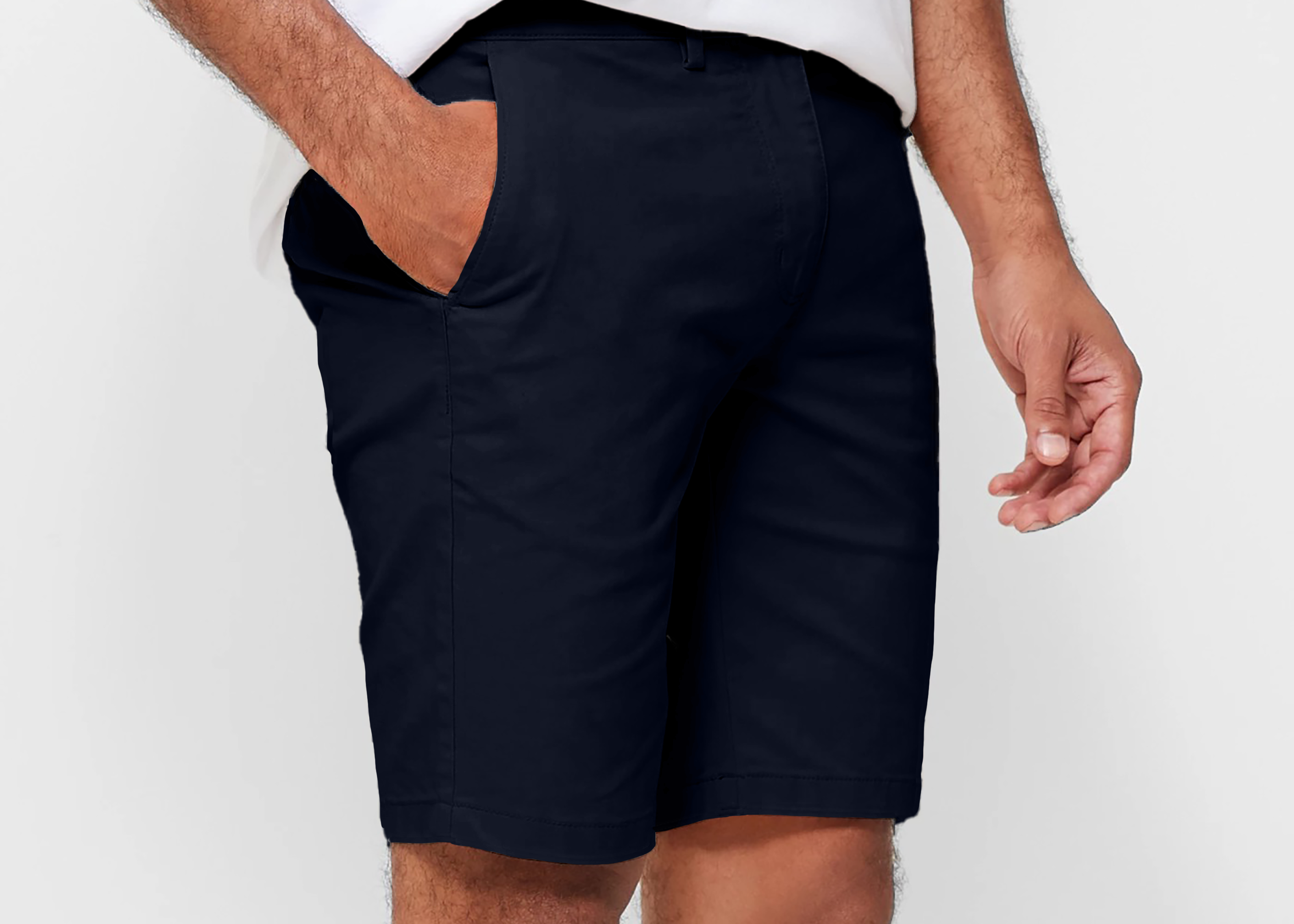 Mens Navy chinos shorts with front slanted pockets, jetted back pockets. zip fly fastening and brown horne buttons on the waistband and back pockets, the fit is a slim fit, this is worn with a white tee and white t-shirt