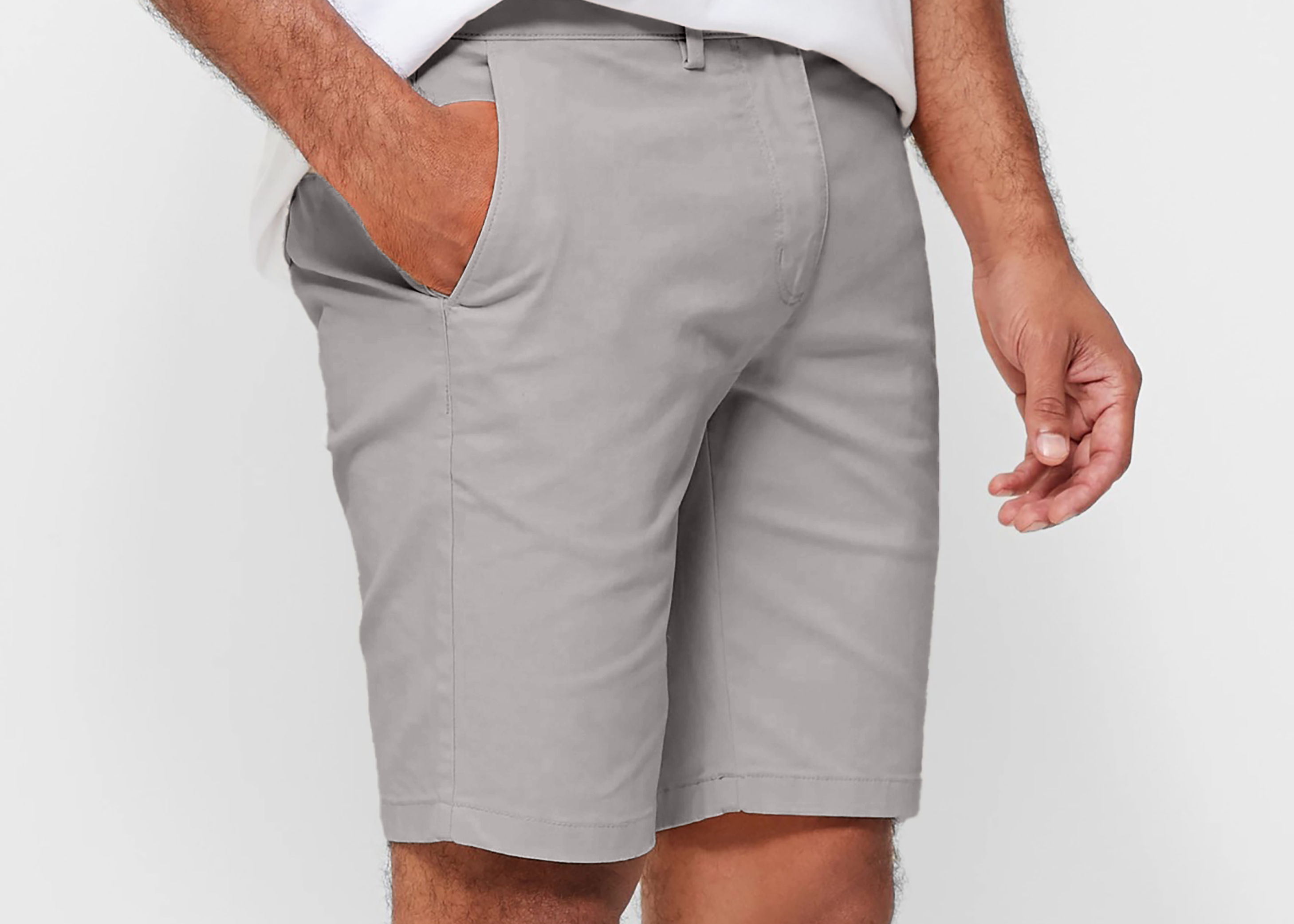 Mens Silver Grey chinos shorts with front slanted pockets, jetted back pockets. zip fly fastening and brown horne buttons on the waistband and back pockets, the fit is a slim fit, this is worn with a white tee and white t-shirt