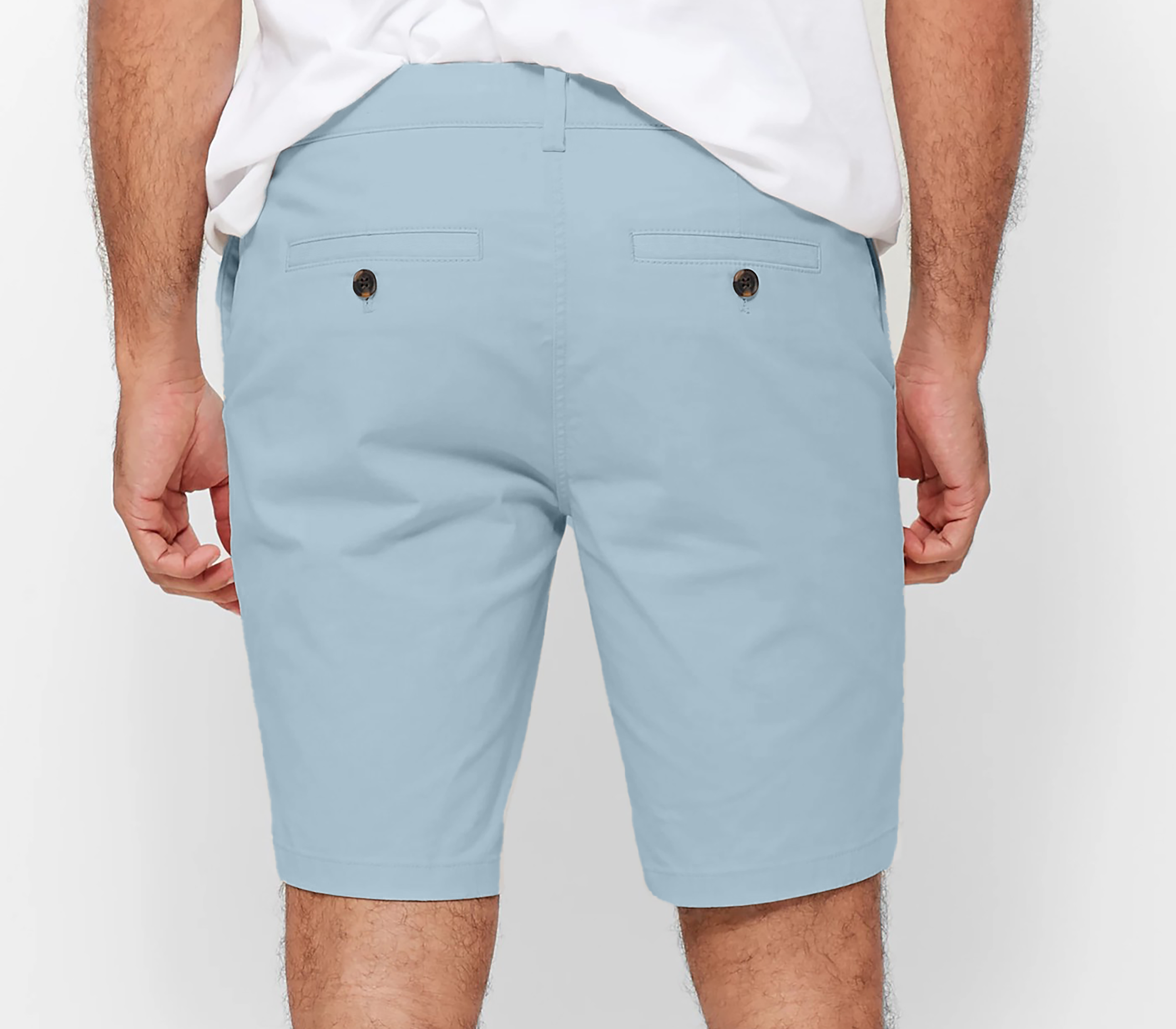 Mens Sky Blue chinos shorts with front slanted pockets, jetted back pockets. zip fly fastening and brown horne buttons on the waistband and back pockets, the fit is a slim fit, this is worn with a white tee and white t-shirt