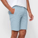 Mens Sky Blue chinos shorts with front slanted pockets, jetted back pockets. zip fly fastening and brown horne buttons on the waistband and back pockets, the fit is a slim fit, this is worn with a white tee and white t-shirt