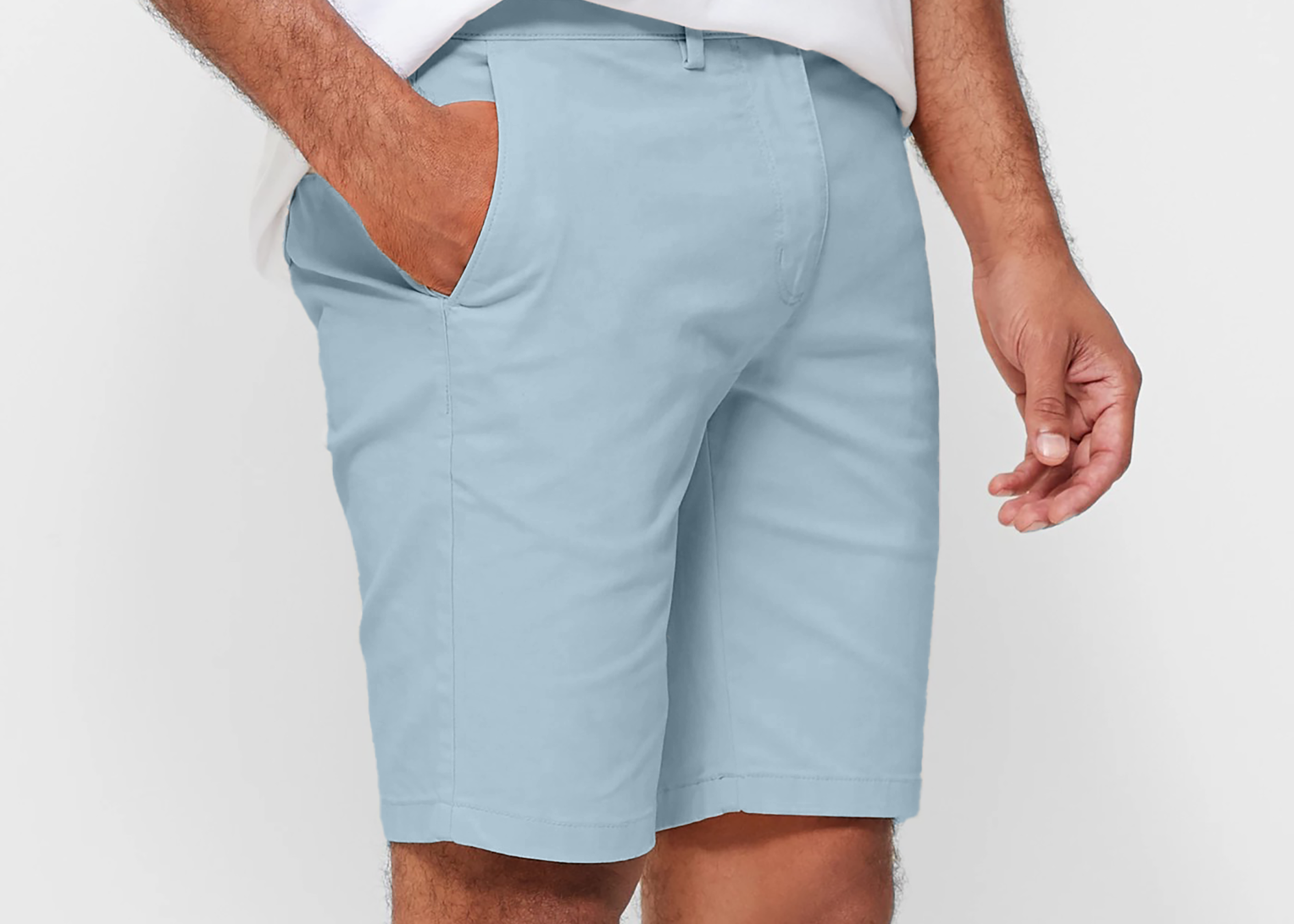 Mens Sky Blue chinos shorts with front slanted pockets, jetted back pockets. zip fly fastening and brown horne buttons on the waistband and back pockets, the fit is a slim fit, this is worn with a white tee and white t-shirt