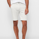 Mens White chinos shorts with front slanted pockets, jetted back pockets. zip fly fastening and brown horne buttons on the waistband and back pockets, the fit is a slim fit, this is worn with a white tee and white t-shirt