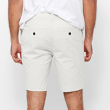 Mens White chinos shorts with front slanted pockets, jetted back pockets. zip fly fastening and brown horne buttons on the waistband and back pockets, the fit is a slim fit, this is worn with a white tee and white t-shirt