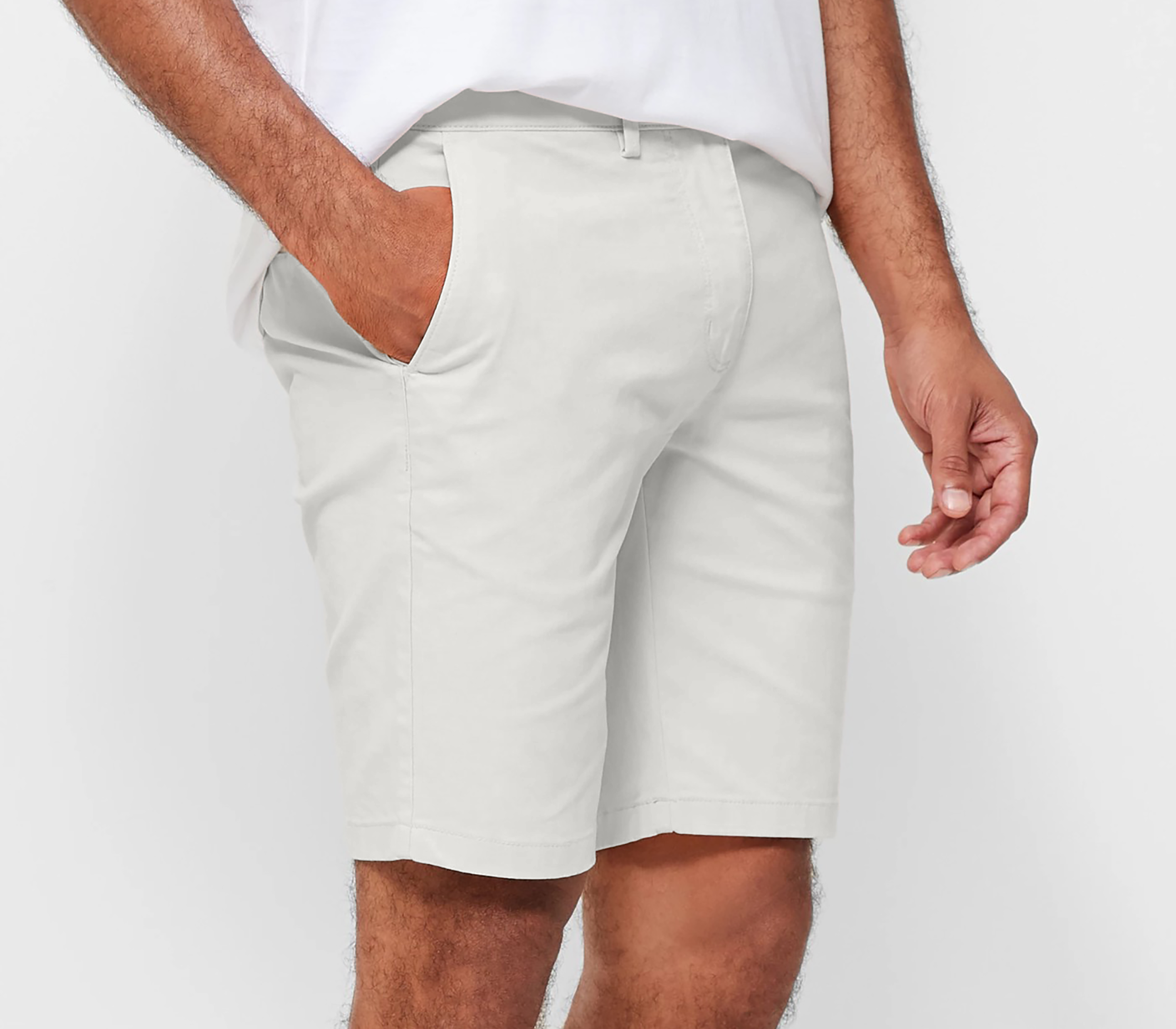 Mens White chinos shorts with front slanted pockets, jetted back pockets. zip fly fastening and brown horne buttons on the waistband and back pockets, the fit is a slim fit, this is worn with a white tee and white t-shirt